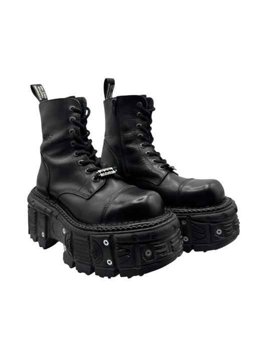 Black leather lace-up platform boots with studded platform sole and pull-tab detail.
