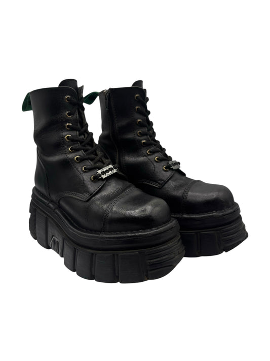 Black leather lace-up platform boots shown from front with chunky lug sole