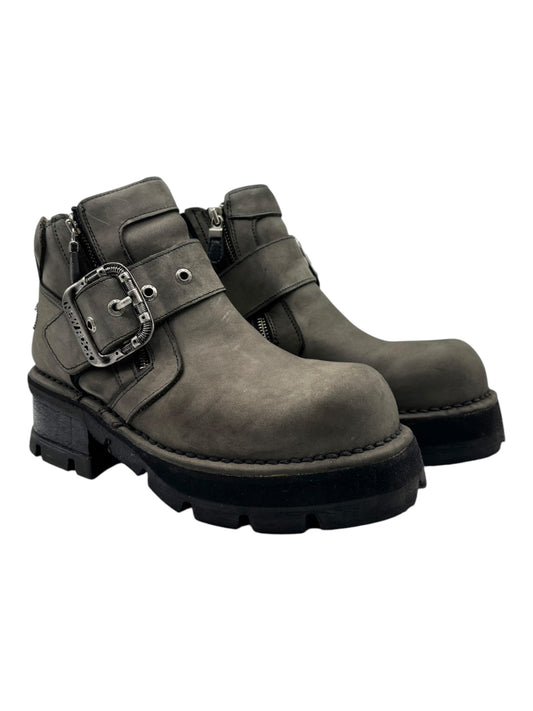 Vintage leather ankle boots with side buckles and dark rubber outsole