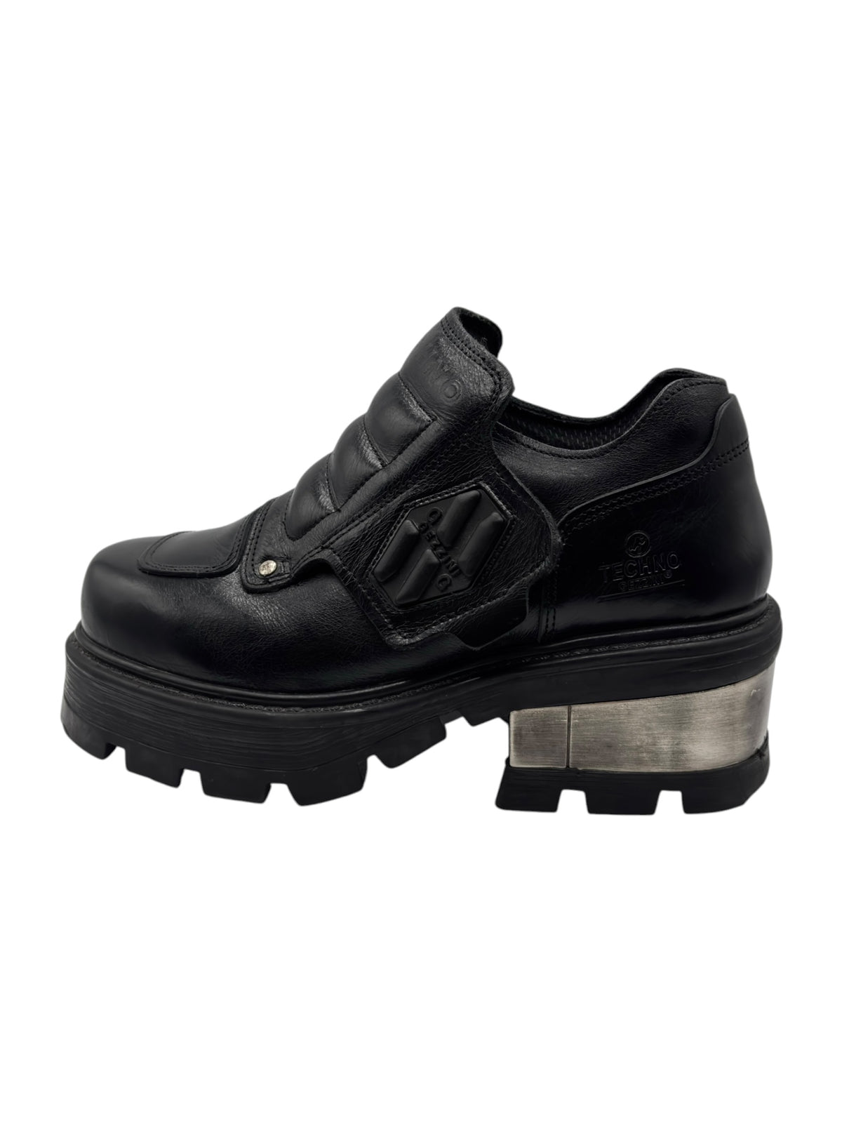 Black ankle platform boots with strap detail, hook-and-loop closure, and lug sole