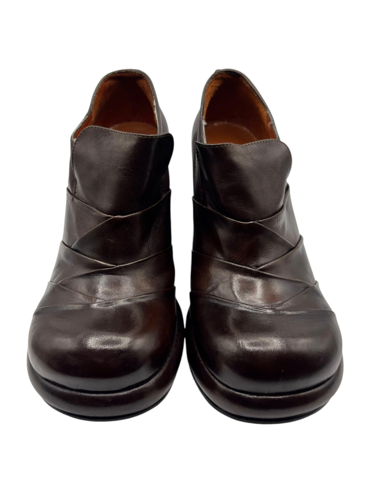 Dark brown leather slip-on heeled booties with curved topline and twin seam lines