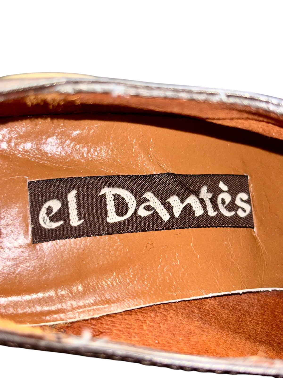 El Dantes dark brown leather heel upper with brand label stitched on