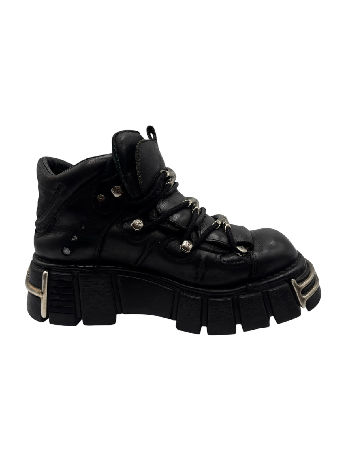 Black lace-up platform boot with metal eyelets and chunky rubber lug sole