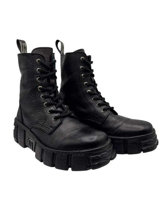 Black leather lace-up platform boots, angled view with thick lug sole