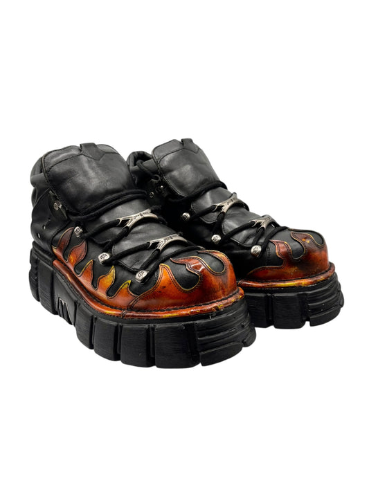 Black flame platform boots with orange flame panels and thick chunky platform soles