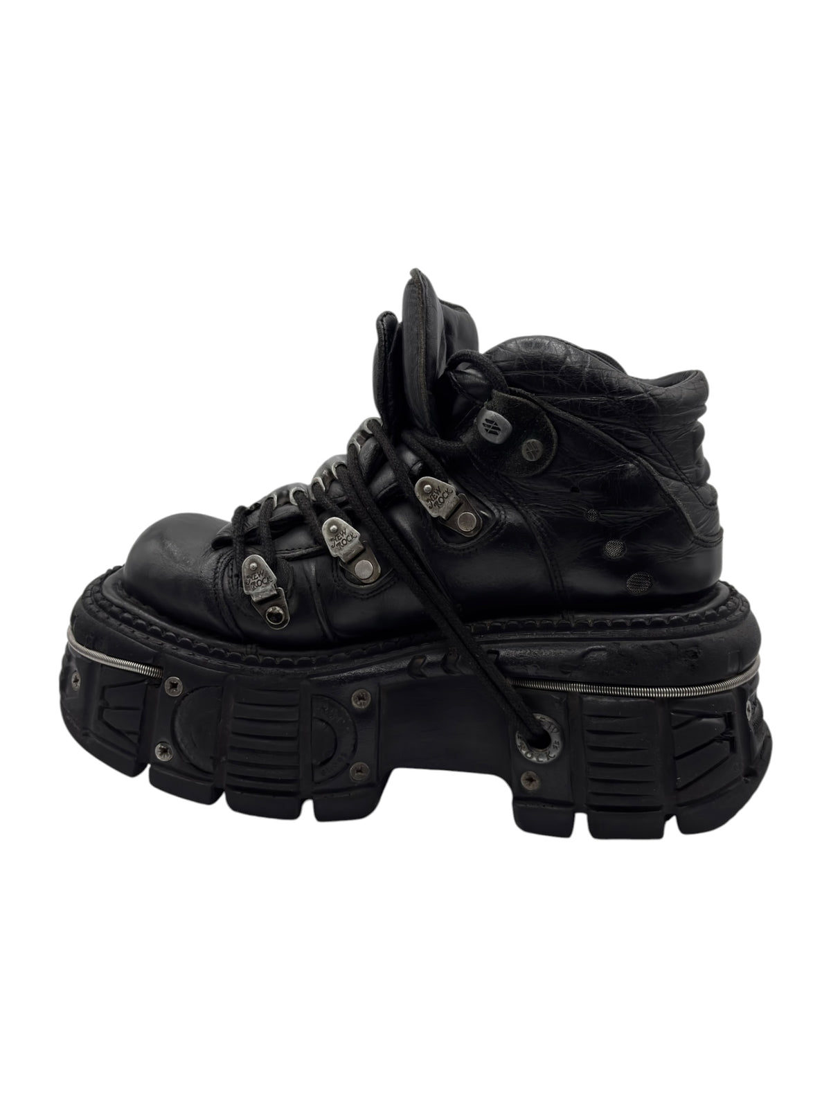 Black platform ankle boots with front laces and silver-tone buckles, side view.
