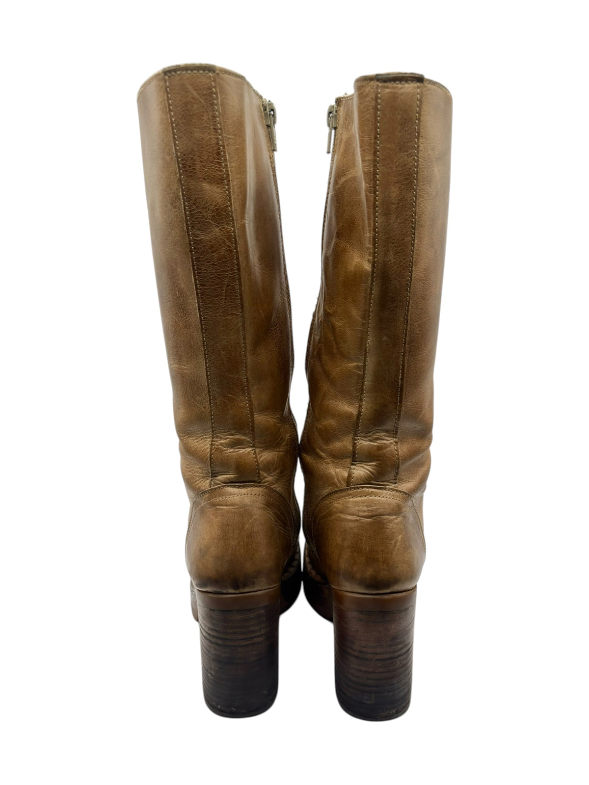 Back view of tan knee-high boots with side zippers and stacked block heels.
