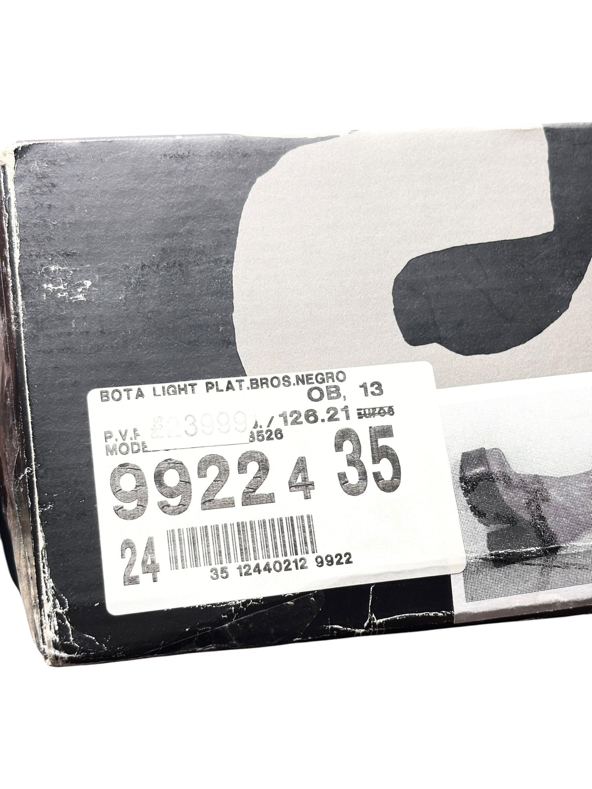 Black knee-high platform boots in box, with size and model label