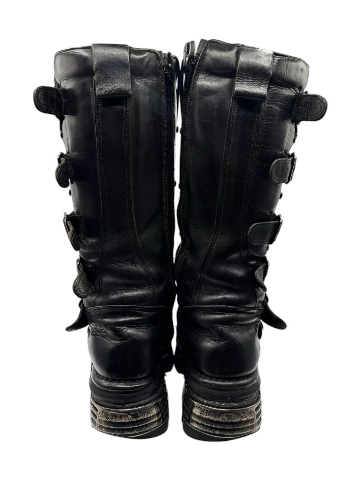Back view of black knee-high boots with gathered leather, strap details, and back tabs