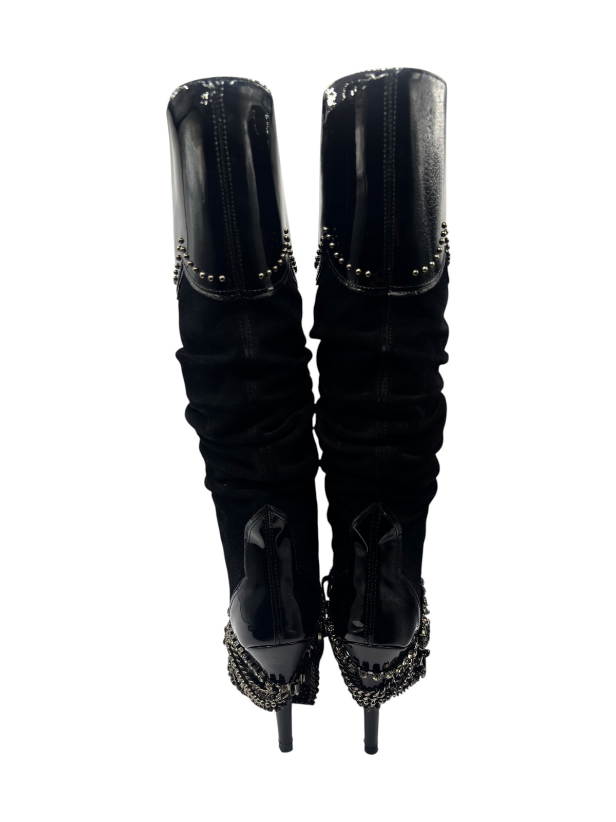 Back view of black knee-high boots with ruched legs and dangling chain trim