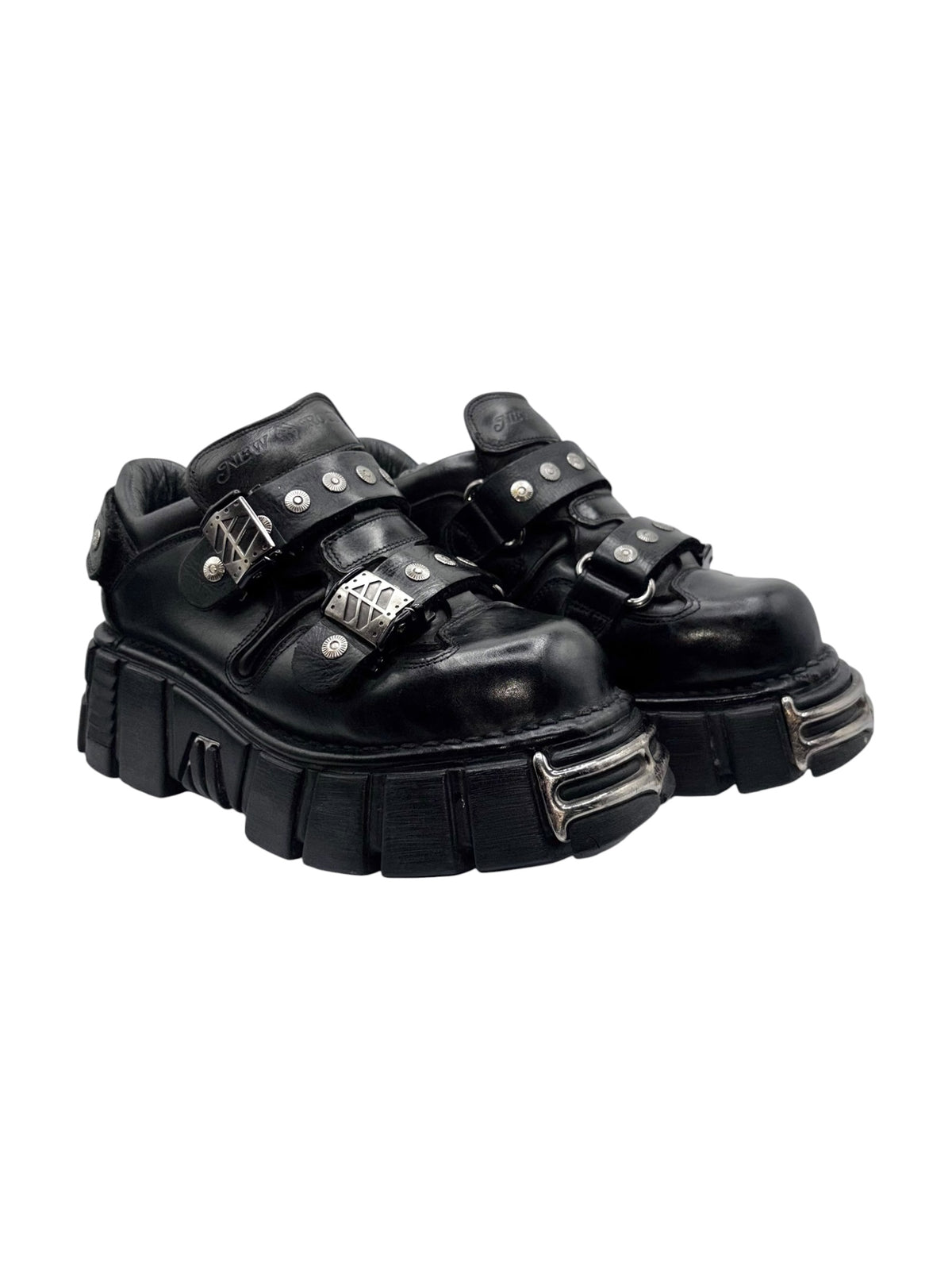 Black studded strap platform boots with buckled ankle straps and chunky sole