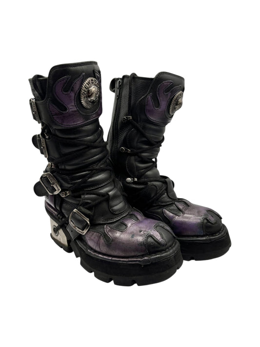 Mid-calf leather boots in black with purple dragon patches and buckled straps