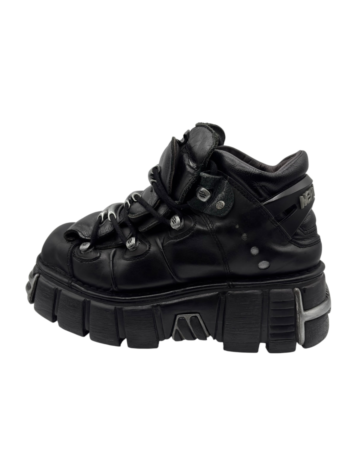 Black lace-up platform boots with chunky sole and side strap details.