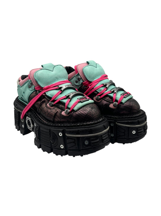 Cyan and pink lace-up platform boots with thick black tread sole