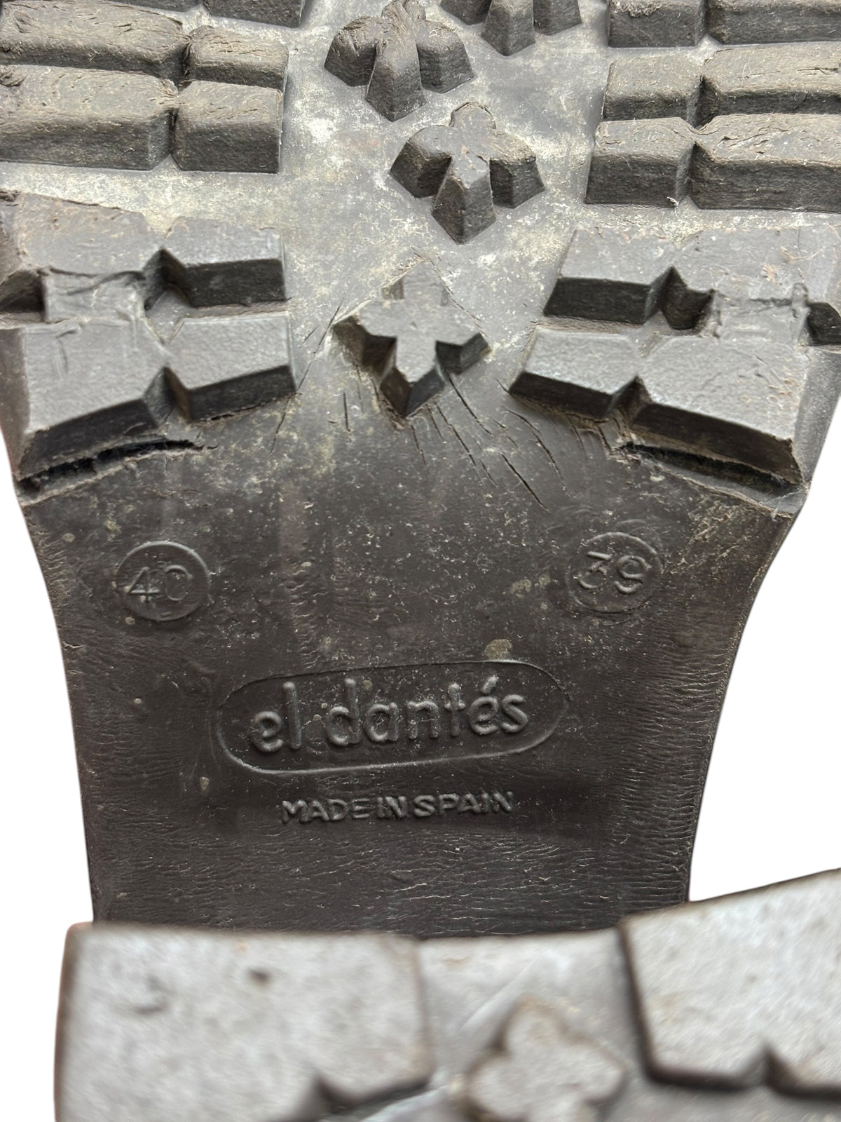 Boot outsole tread with embossed 'el dantes' and 'Made in Spain' text