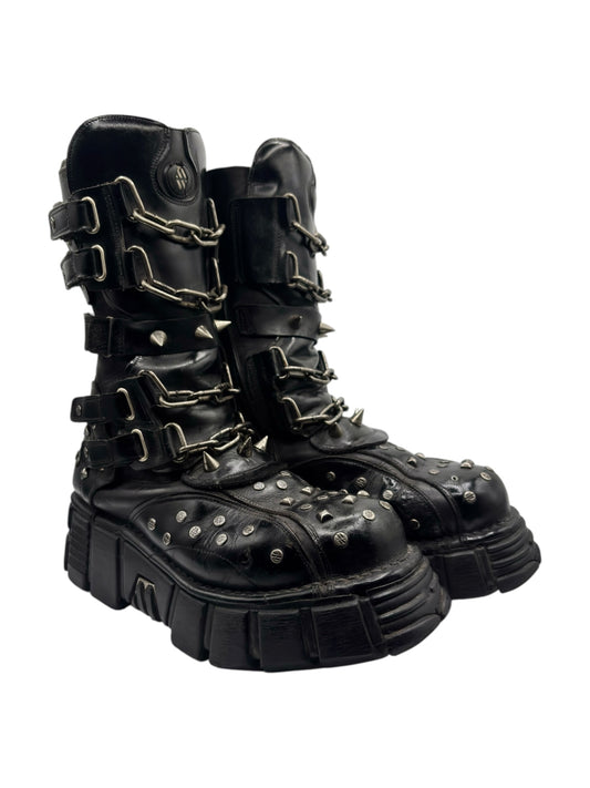 Black studded platform boots with chunky sole and chain-link straps
