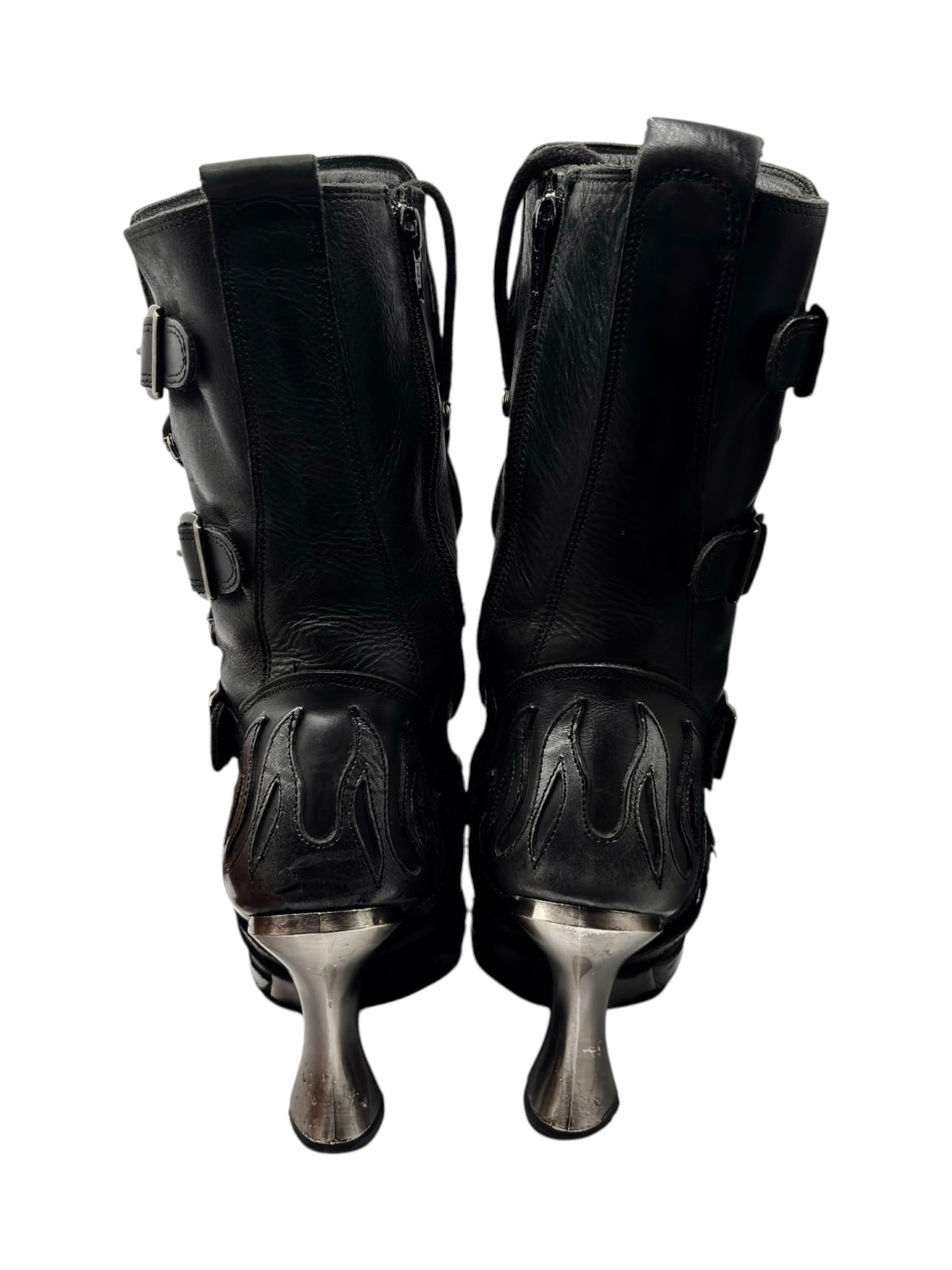 Back view of flame boots with tall black shafts and silver metal heel tips