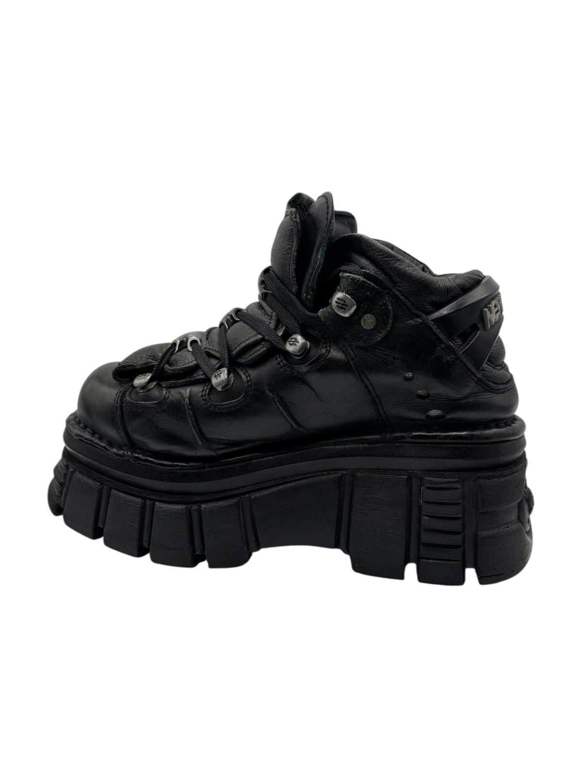 Black lace-up platform boots with quilted-look panels and heavy outsole tread.