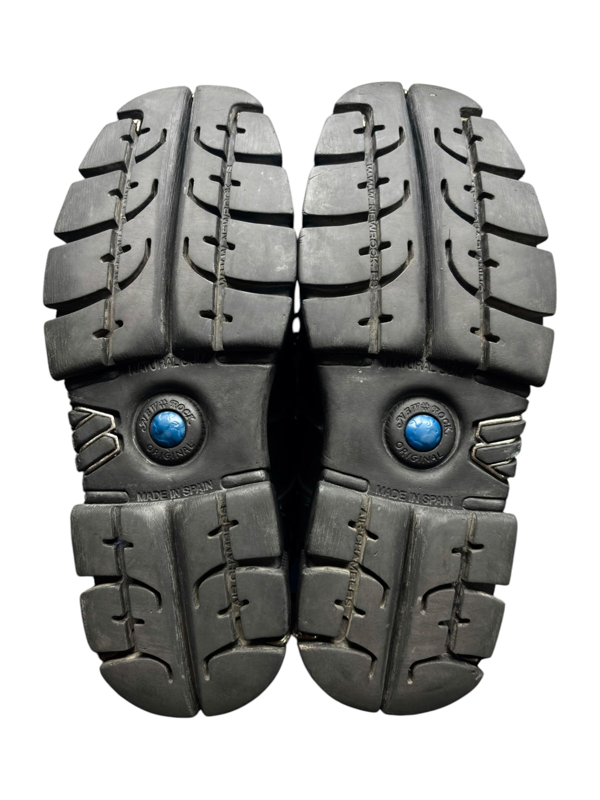 Pair of gray platform boots with chunky lug soles and lace-up eyelets