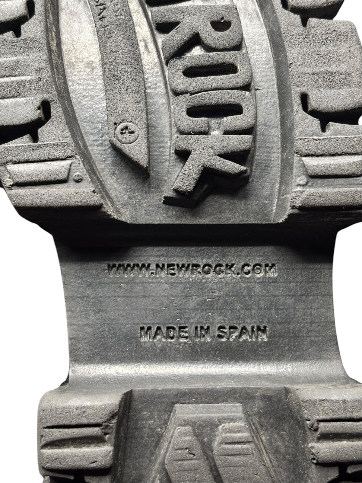 Black platform boot outsole bottom with “NEW ROCK” and “MADE IN SPAIN” text.