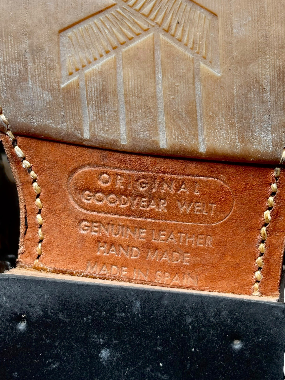 Beige boot interior tag reading Goodyear welt, genuine leather, made in Spain