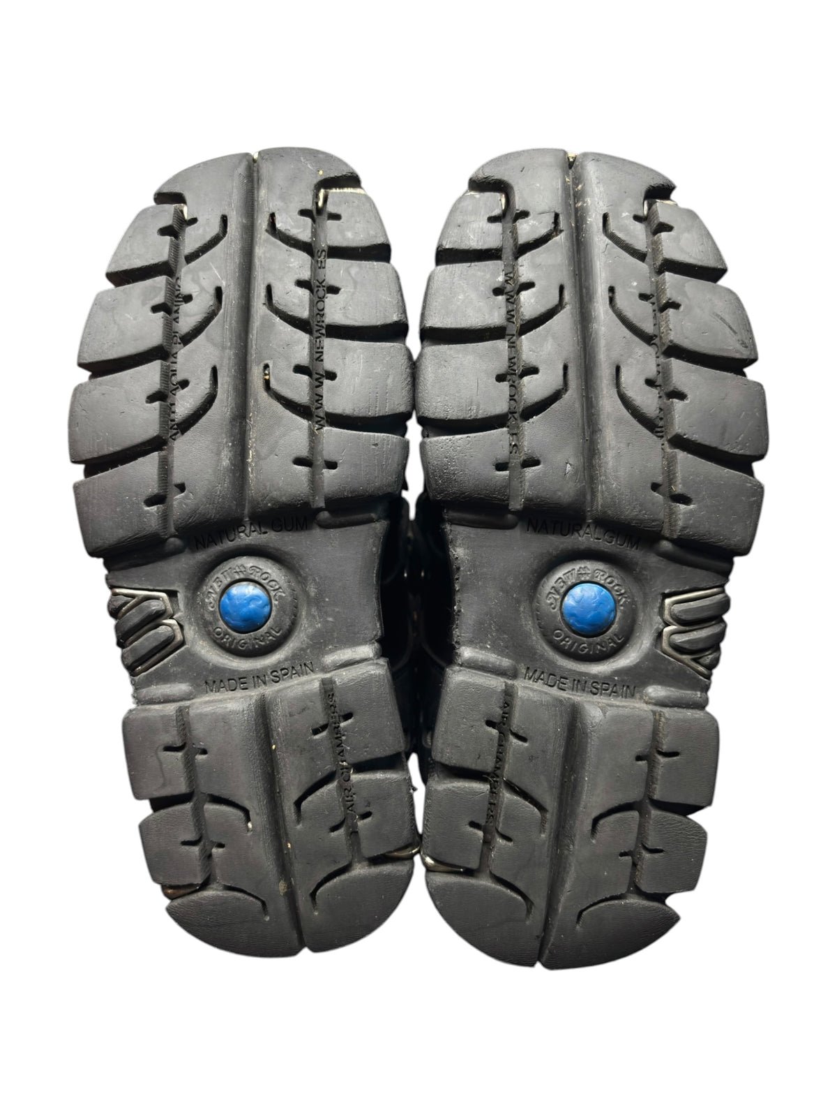 Pair of black platform boot outsoles with deep tread and blue emblem details