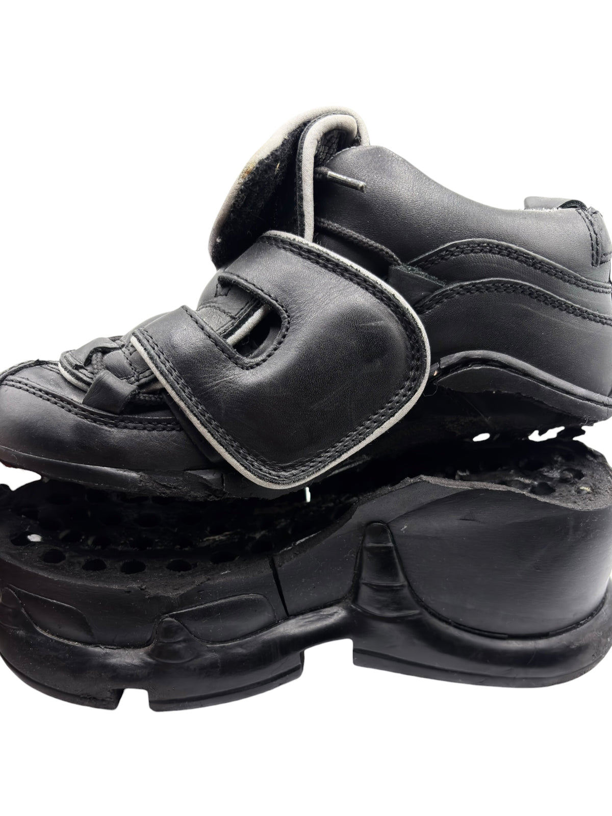 Black platform boots with double buckle straps and thick chunky sole.