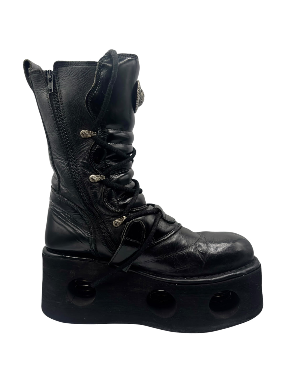 Black mid-calf platform boots with lace-up front and multiple buckle details