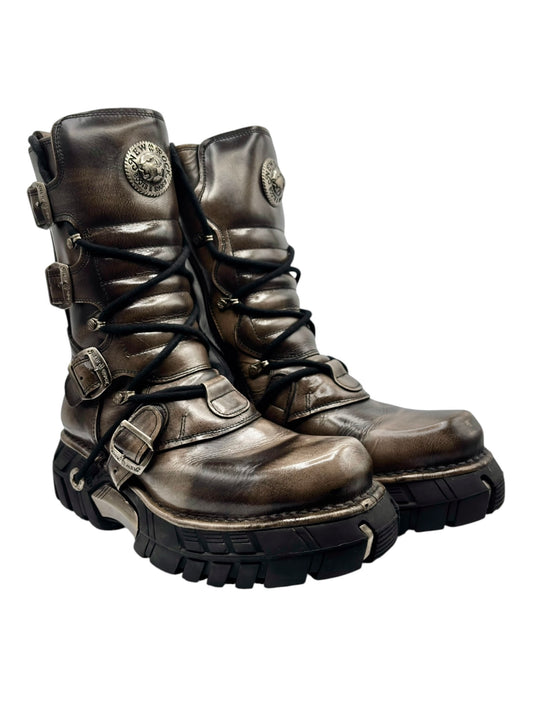 Vintage lace-up leather boots with side buckles and rugged treaded black sole