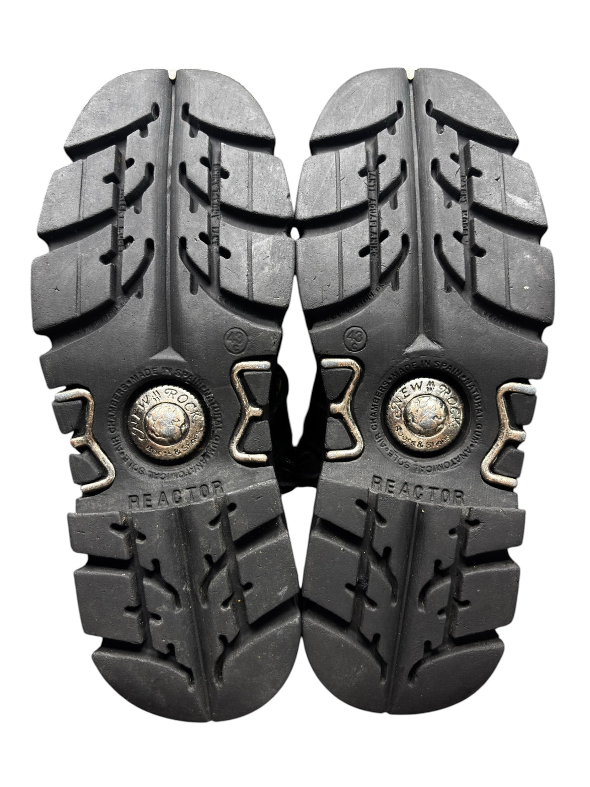 Reactor boot outsole tread with rugged pattern and branded circular medallions