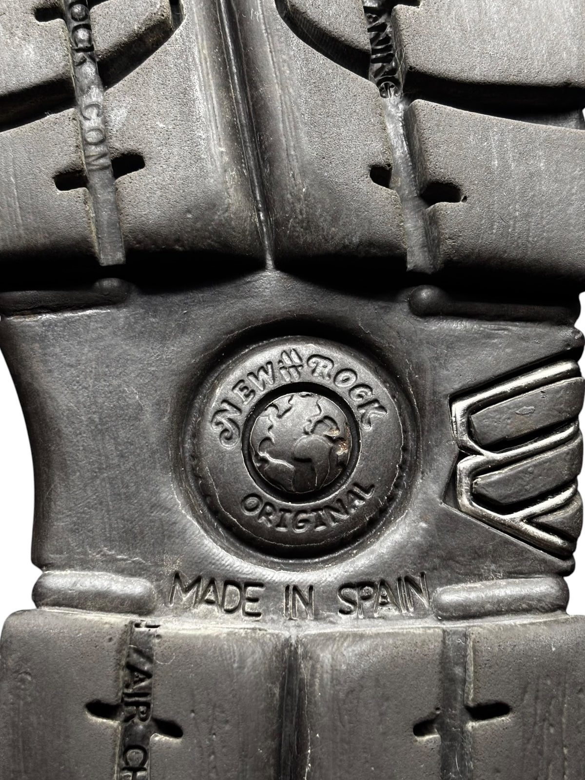 Chunky black platform boot side with logo badge, stitching, and lace straps.