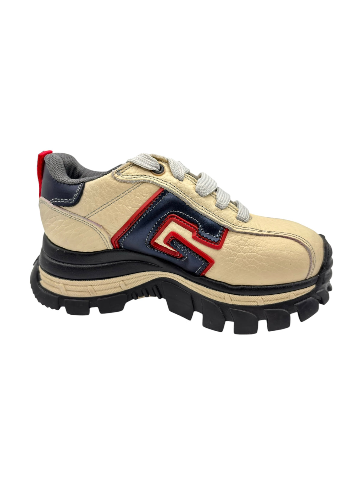 Beige leather sneakers with red, navy applique details and chunky black tread
