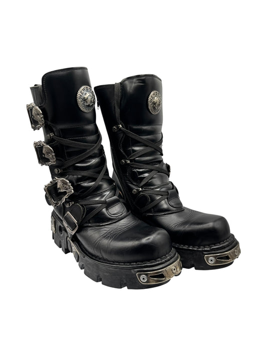 Black leather lace-up combat boots with side buckles, metal toe guards, chunky sole