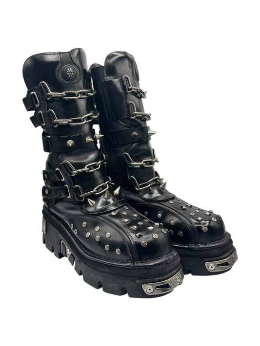 Studded leather boots with chain buckles, metal studs on toe and side