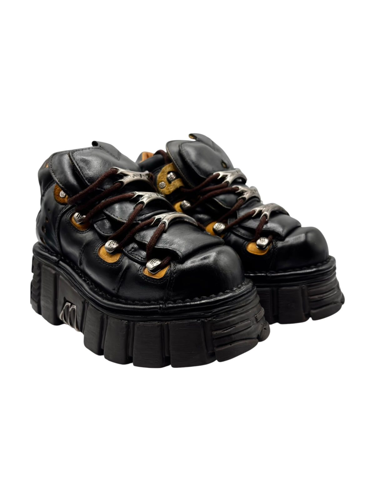 Two black lace-up platform boots with thick ridged soles and metal eyelets.