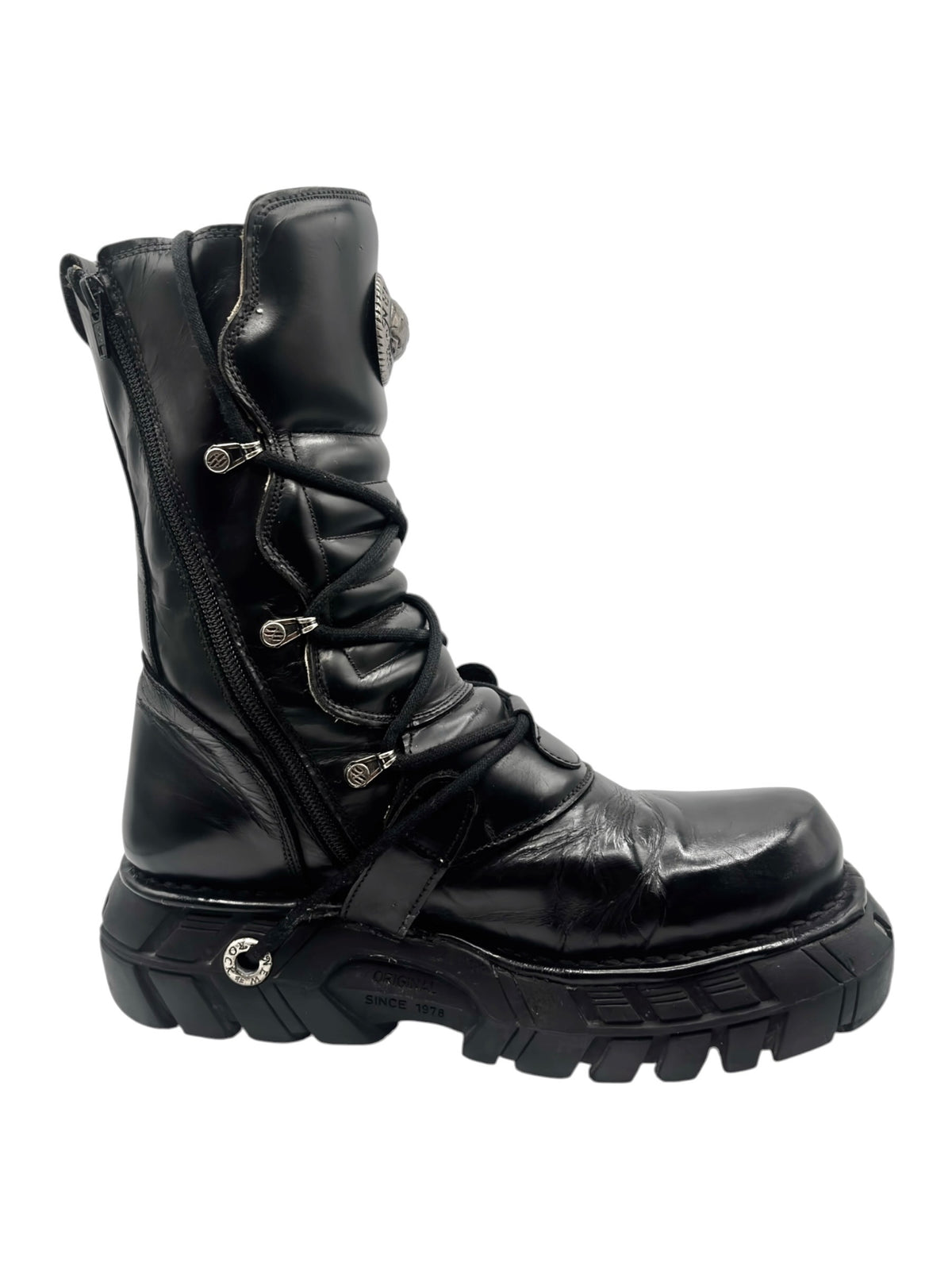 Black leather ankle boots with lace-up front, adjustable straps, and chunky platform sole.