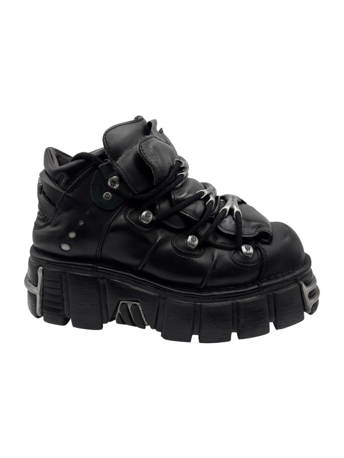 Black platform boots with lace-up closure and layered panel details on sole.