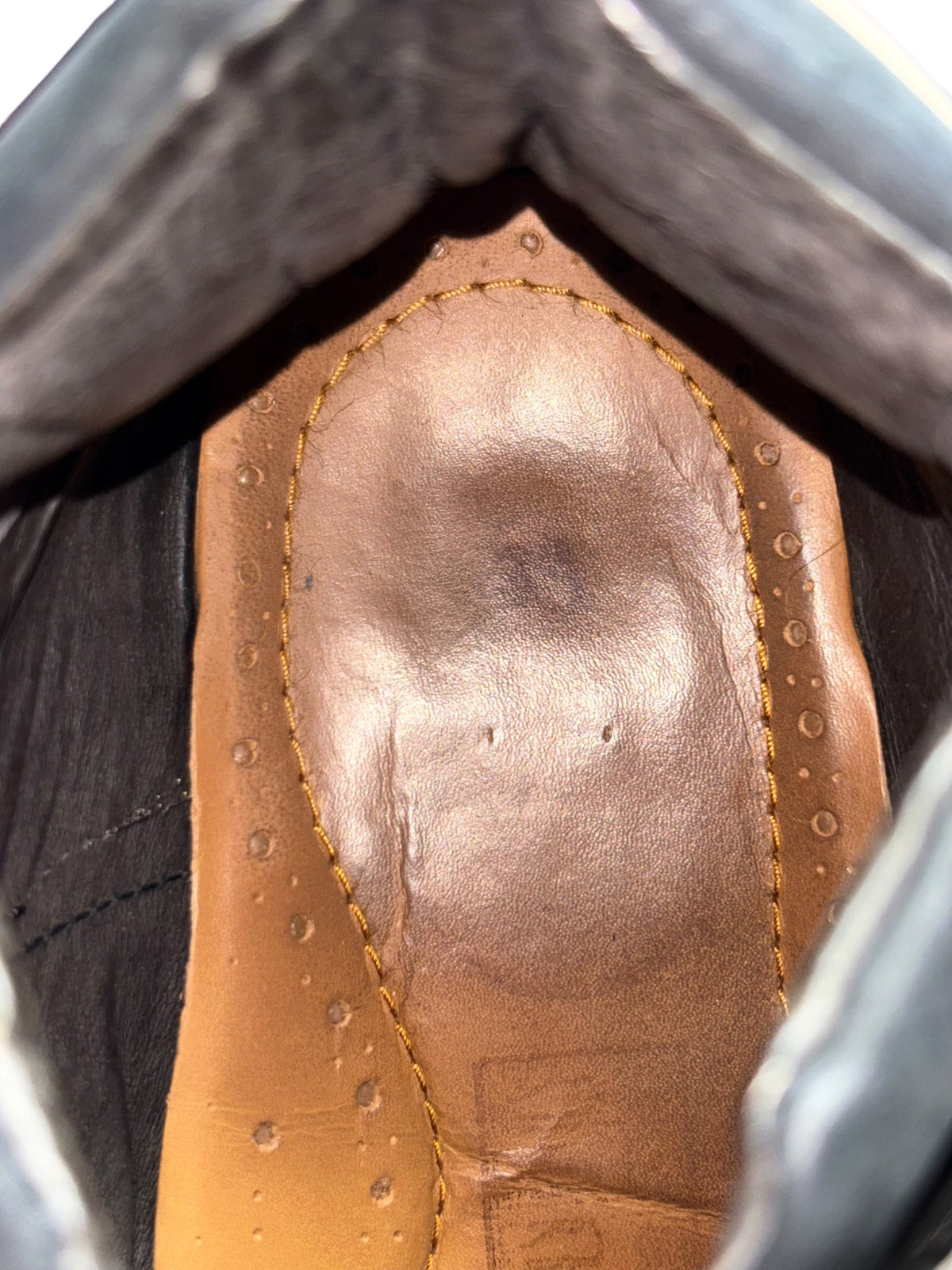 Beige leather platform boot interior with stitched lining and cushioned insole