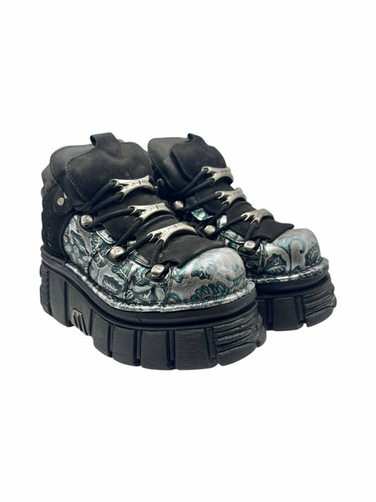 Rare vintage New Rock platform boots, 3/4 view with dark upper and silver-toned toe artwork
