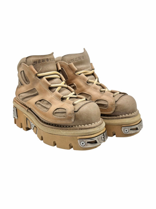 Beige platform boots in angled view with lace-up sides and chunky tread base
