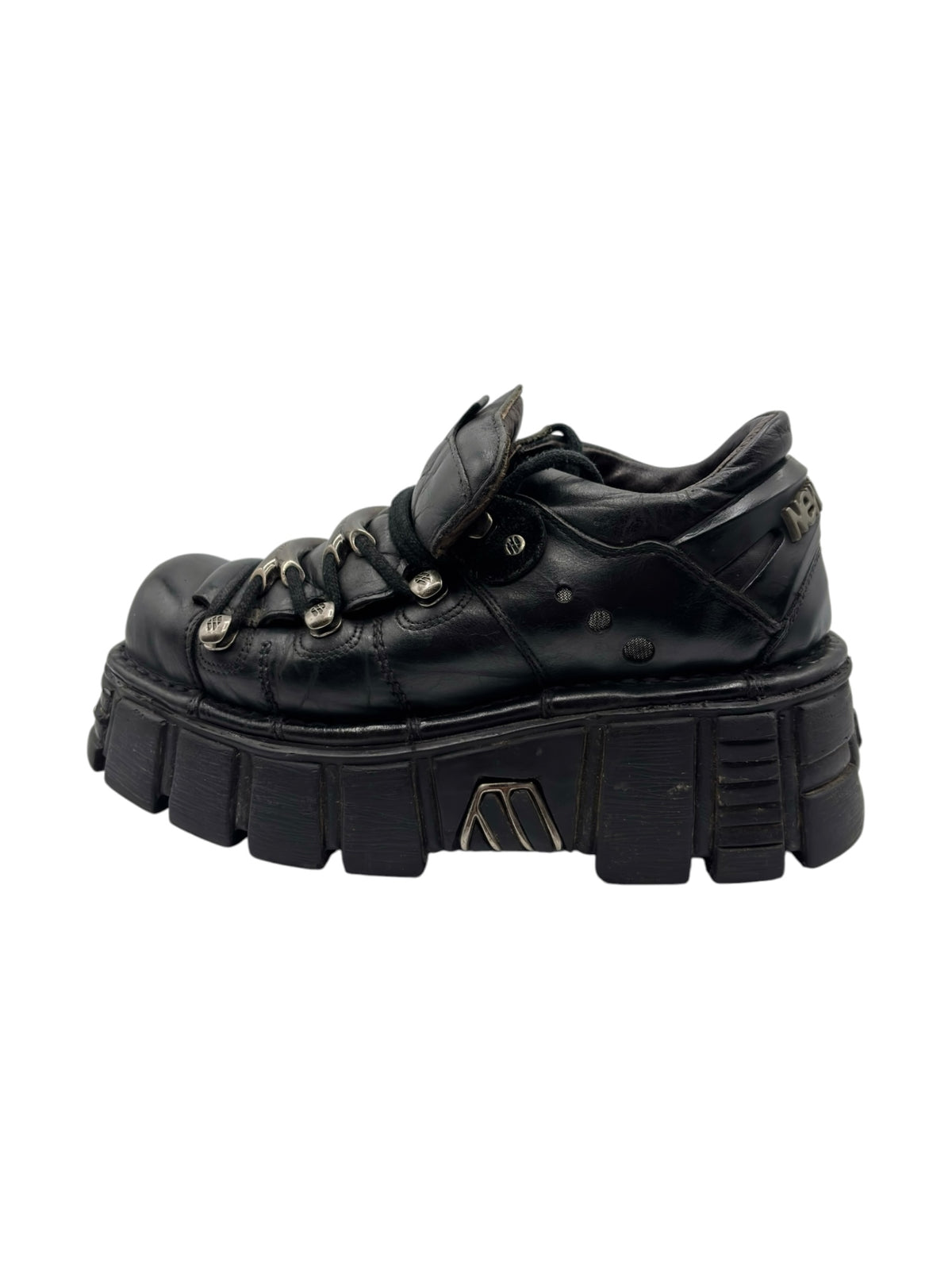 Vintage black leather platform boots with lace-up front, chunky sole, and metal eyelets.