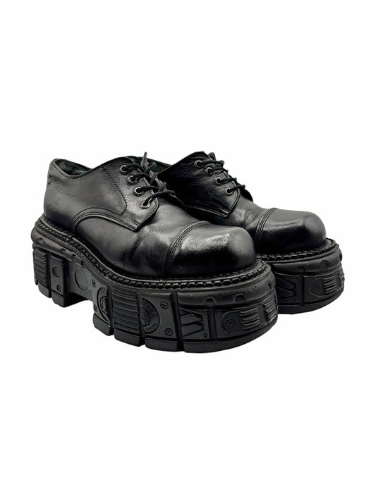 Platform lace-up leather boots with chunky black sole and rugged tread