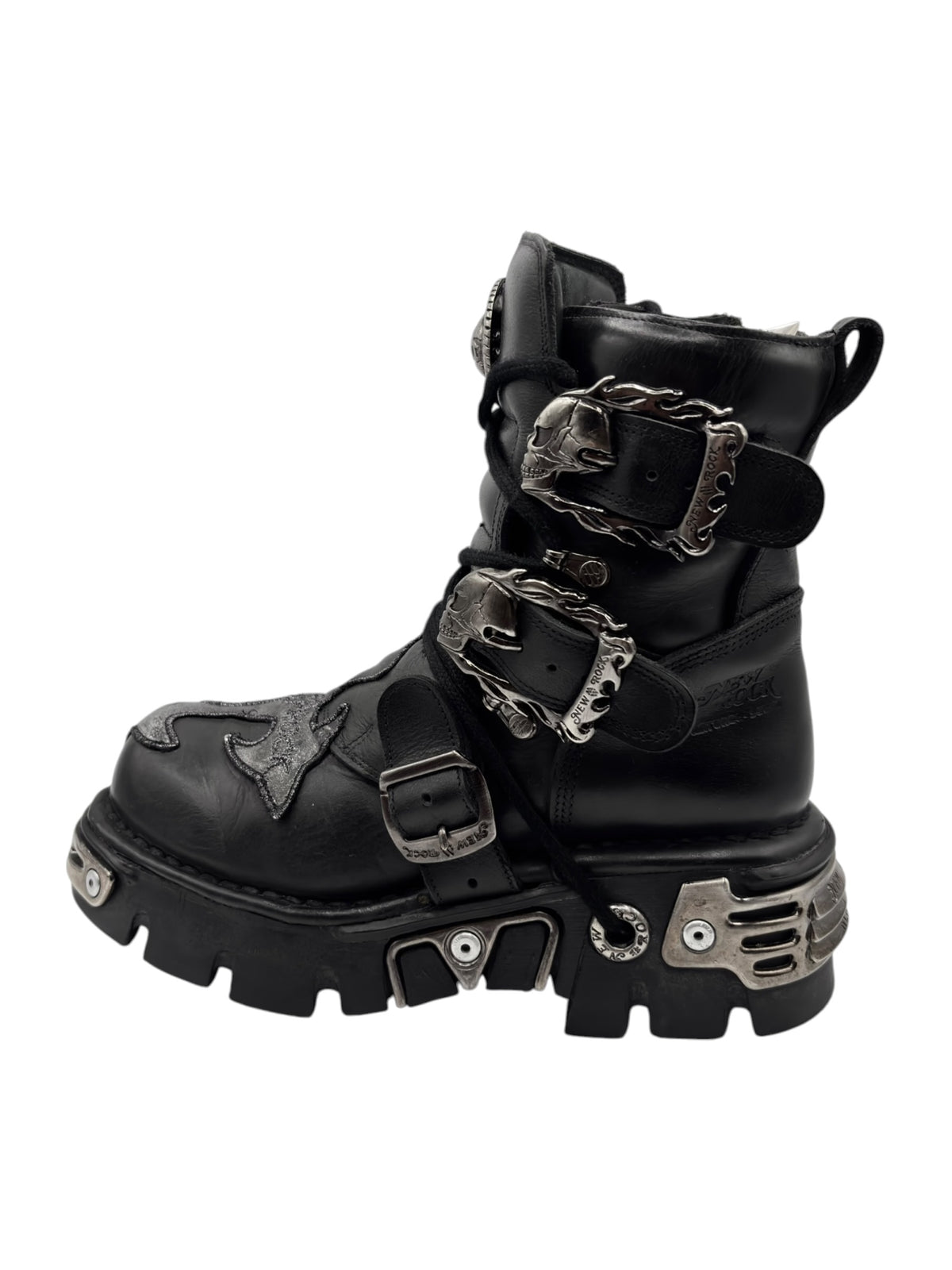 Black lace-up platform boots with buckled straps and metallic accents on the sides
