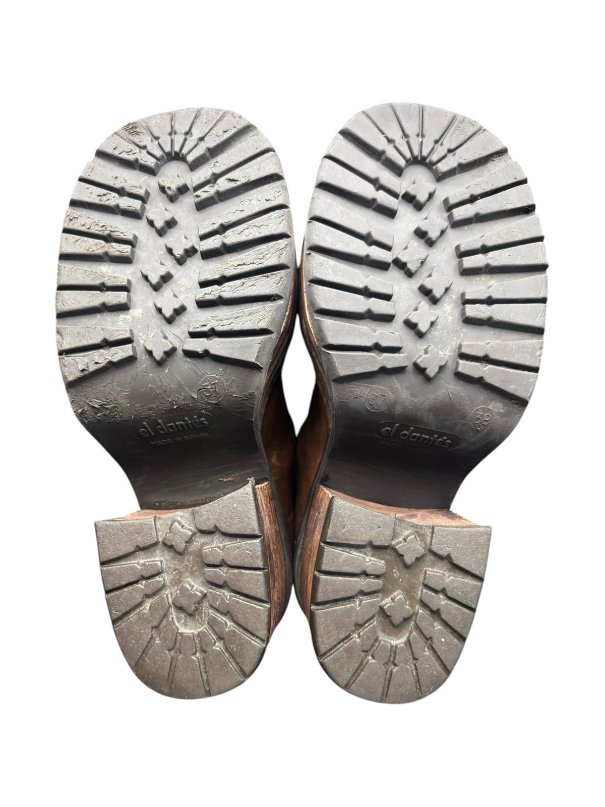 Pair of brown leather platform boot soles with textured tread