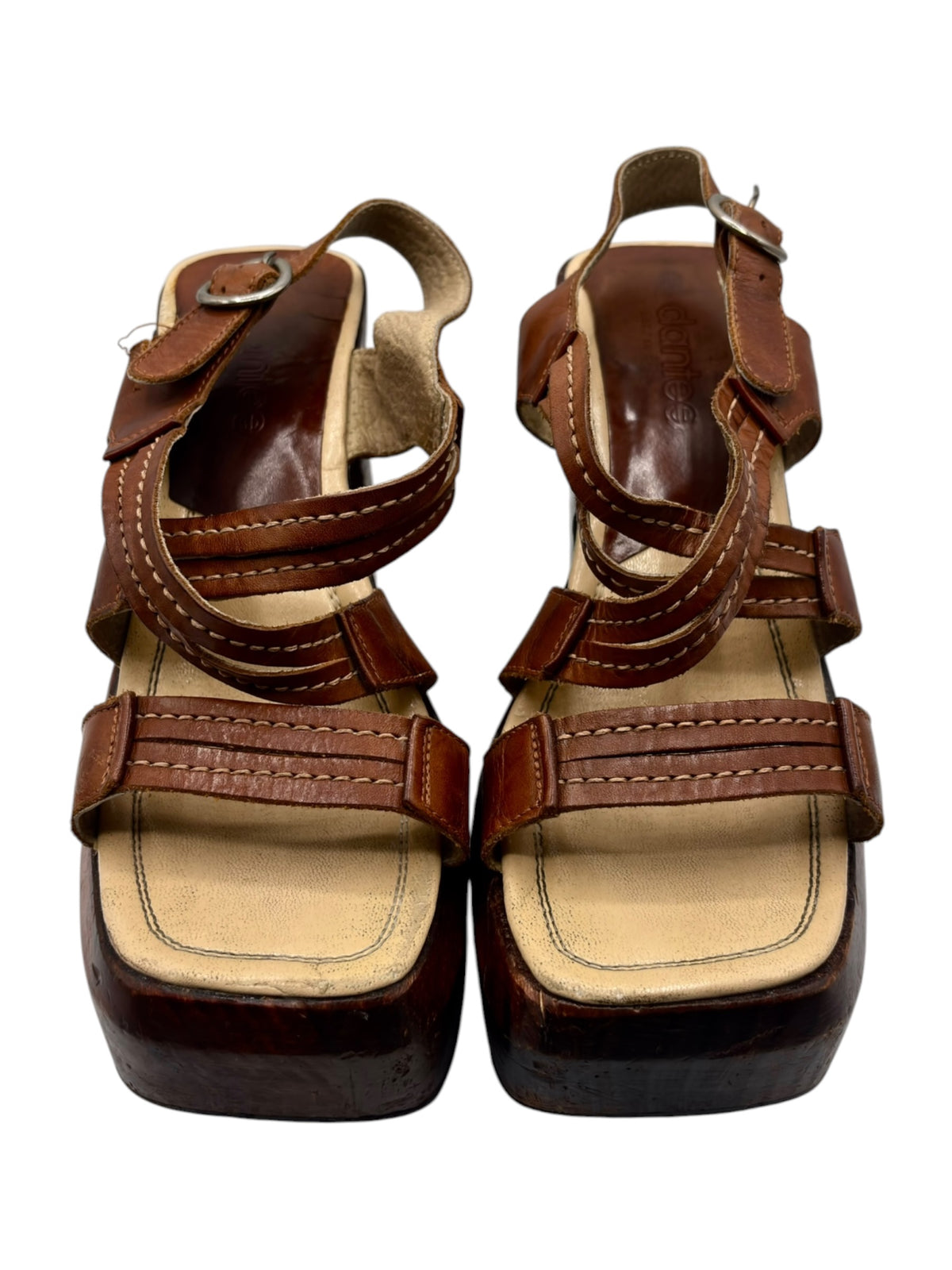 Brown leather block platform boots with adjustable buckle straps, cushioned footbed