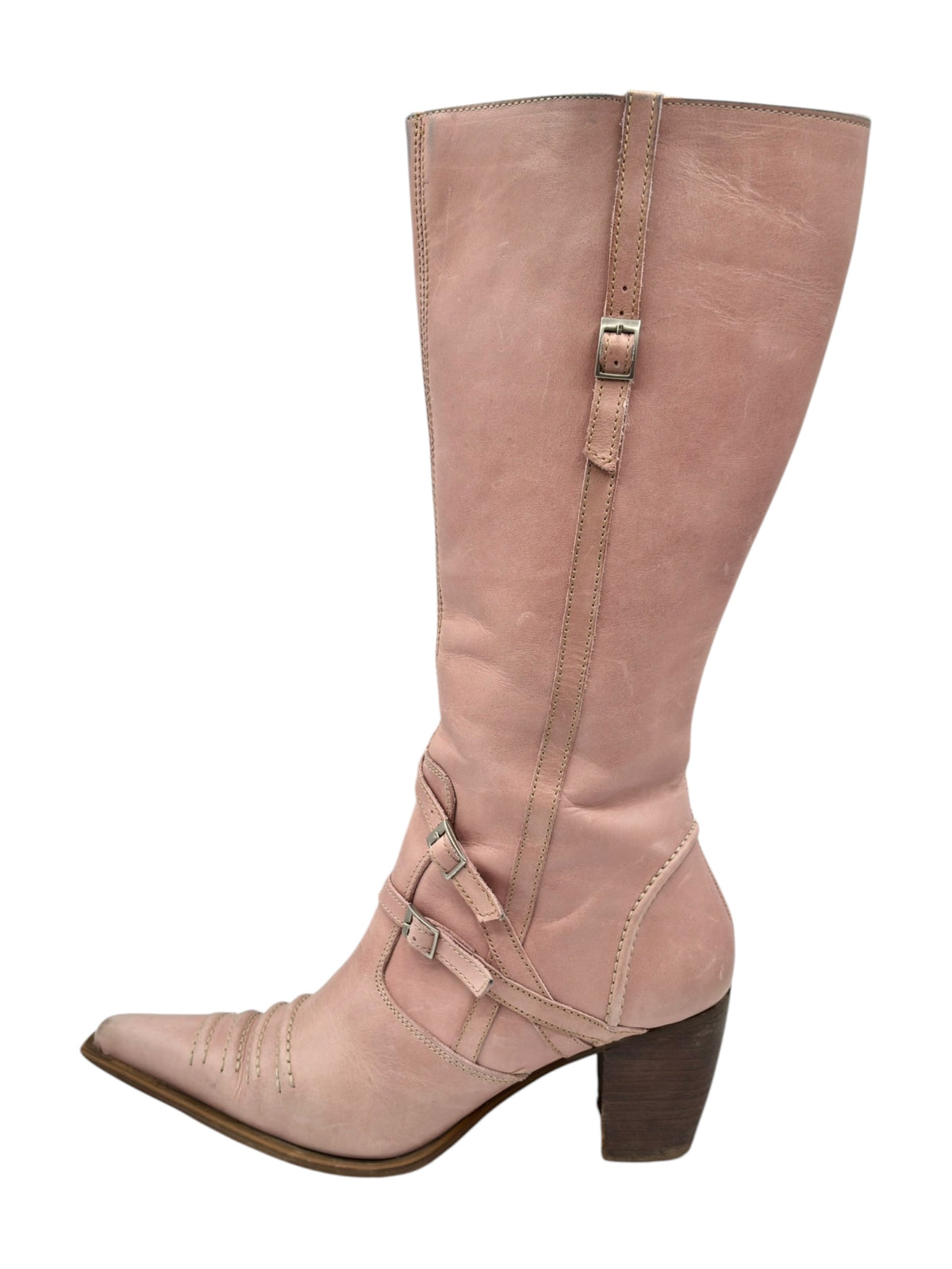 Pink leather pointy-toe knee-high boots with side zip, buckle strap, and low heel
