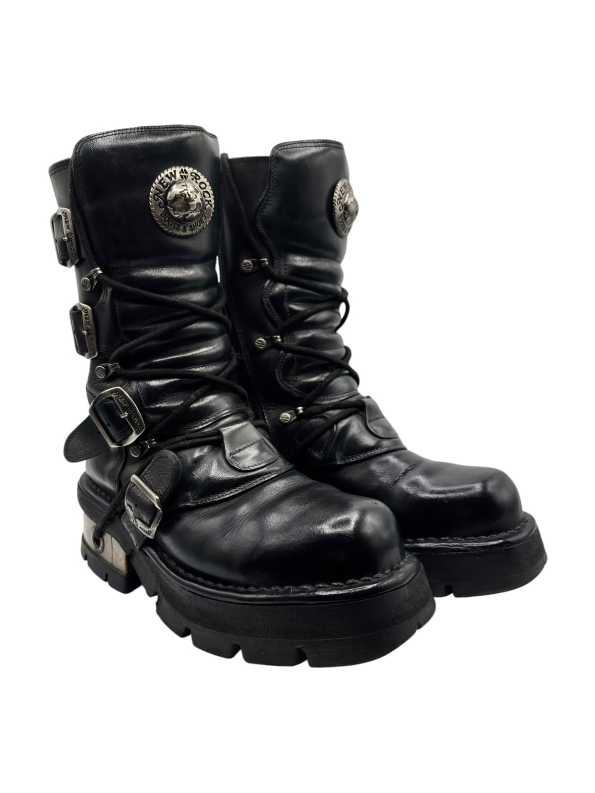 Vintage mid-calf steel-heel boots in black leather, with side buckles and logo patch