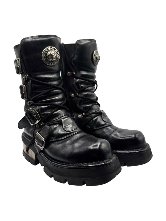 Vintage mid-calf steel-heel boots in black leather, with side buckles and logo patch