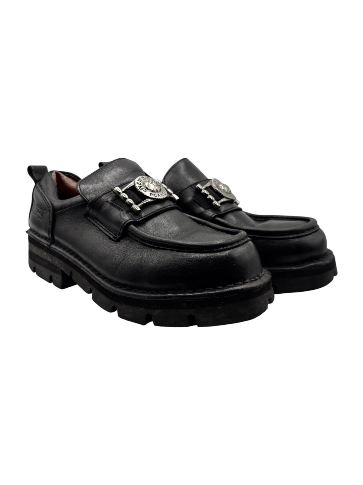 Black leather loafers, side view, double buckled straps and thick treaded sole