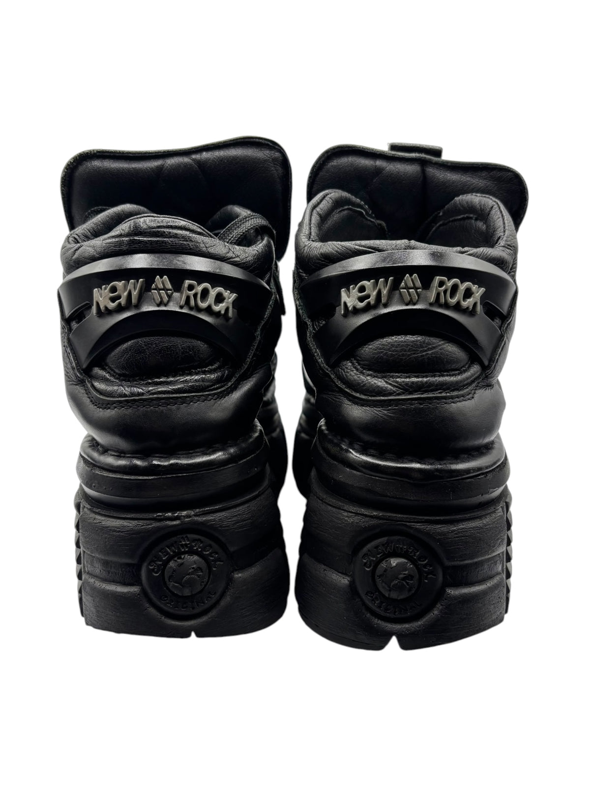 Black platform boot heels with New Rock logo and padded back collar.